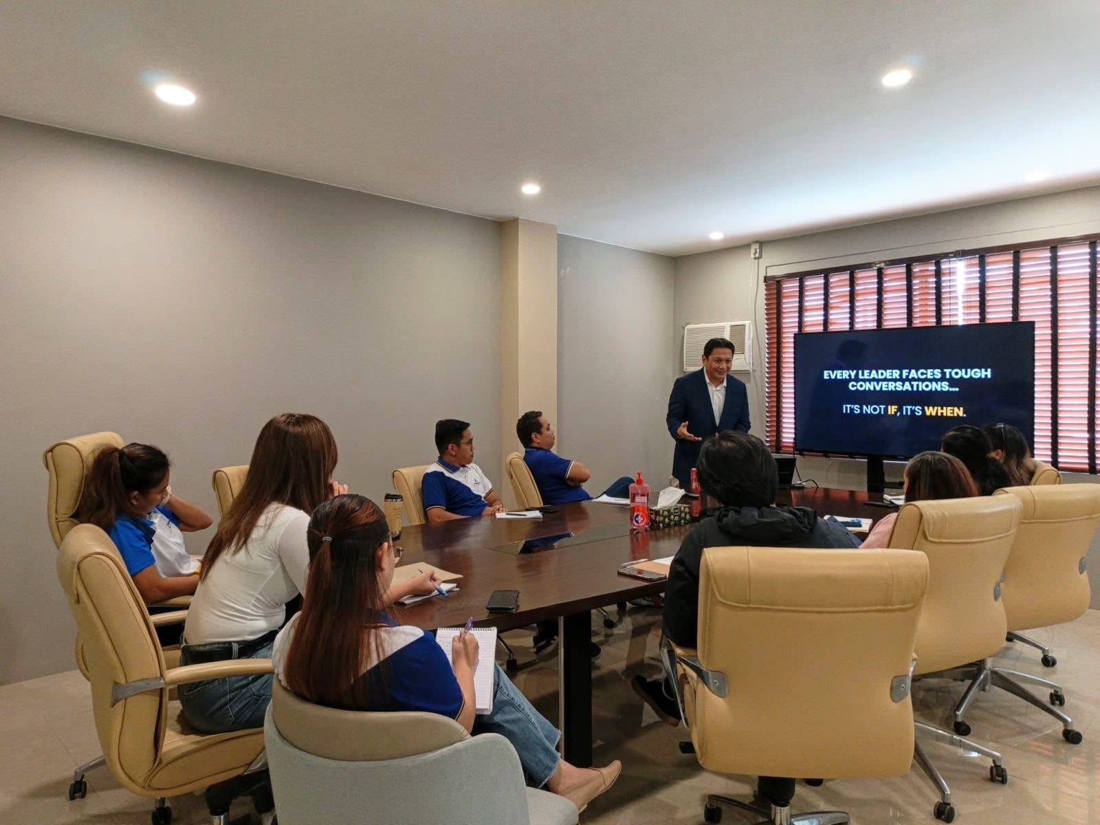 Coach Jon Engalla speaking to a leadership group